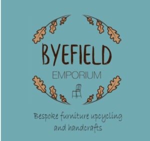 Byfield emporium logo gold oak leaves on a pale blue background with the words Byfield emporium, bespoke furniture recycling and handcrafts